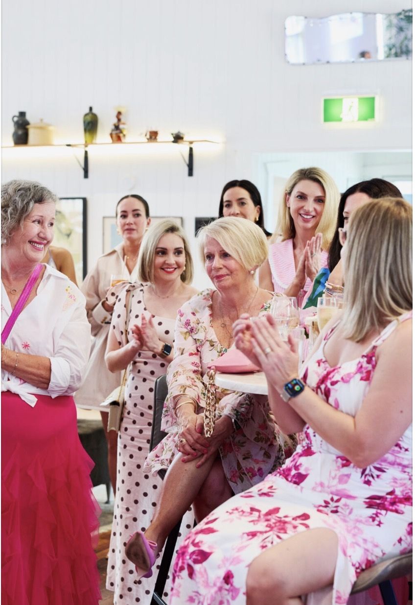 Guests in pink enjoying the fundraiser
