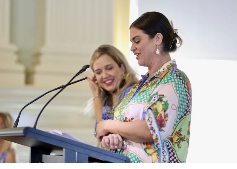 Sharing a laugh at the podium